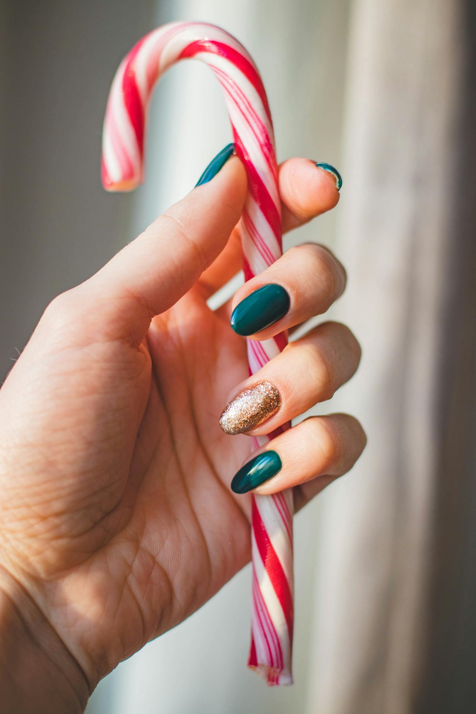 red Christmas nails 2025 with candy cane festive nail art