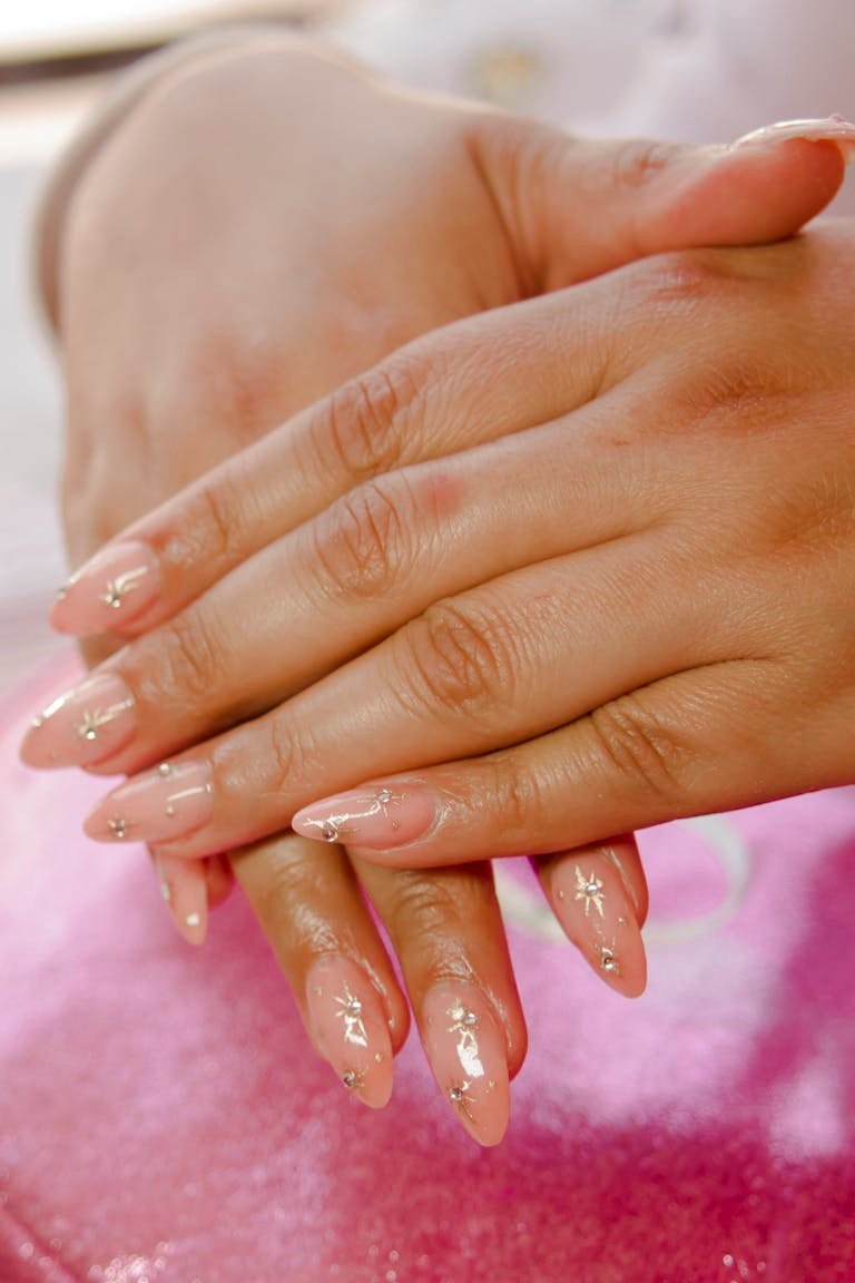 Bubble bath nails 2026 - elegant sheer pink manicure on delicate hands with glazed finish