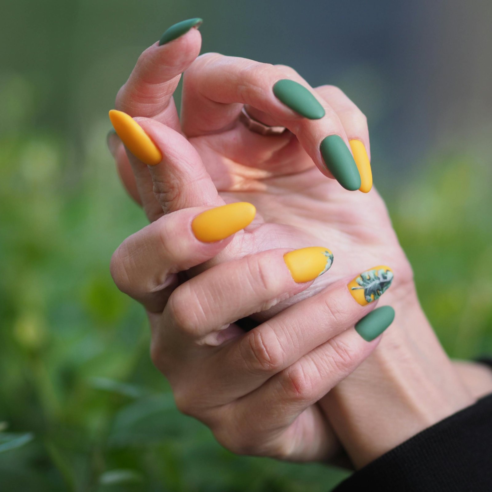 Spring nail colors 2026 — colorful pastel manicure with green and yellow nail polish